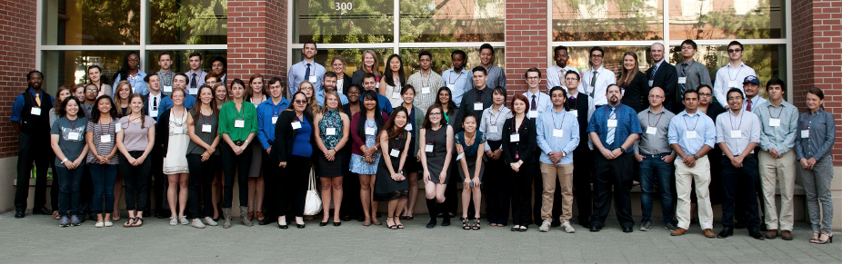Student participants of the 2016 Summer Undergraduate Research Program stand together outside the CUE building.