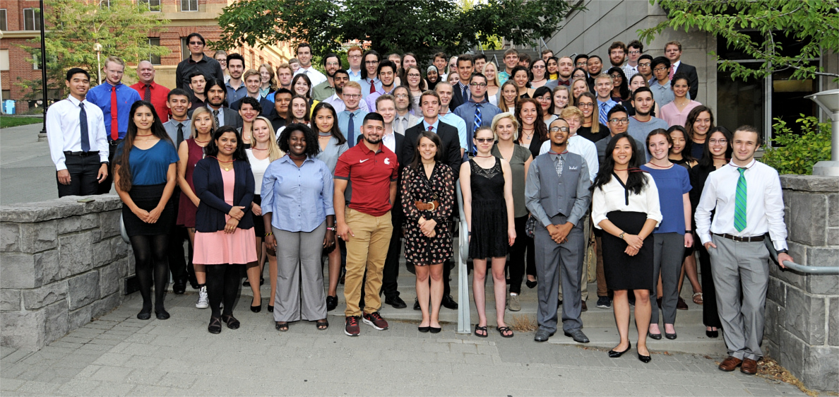 Student participants of the 2017 Summer Undergraduate Research Program stand together outside the CUE building.